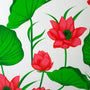 Polyester silk fabric with pink lotus flower and green leaves on white.