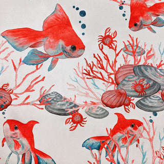Polyester silk fabric with red goldfish and crabs amongst coral, shells, and seaweed on white.
