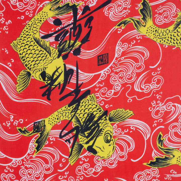 Polyester silk fabric with a print of large yellow koi fish swimming amidst swirls of white and thick black calligraphy.