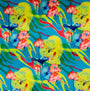 Polyester silk fabric with neon design of an underwater wonderland, fish swimming amongst dark blue lotus leaves and bright green seaweed.
