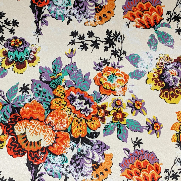 Polyester silk fabric with floral print, featuring a glistening creamy background.