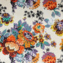 Polyester silk fabric with floral print, featuring a glistening creamy background.
