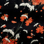 Black polyester silk fabric with white cranes swooping down and flying around falling orange flowers. This fabric is used to create our Hoi An Vietnamese Lanterns.